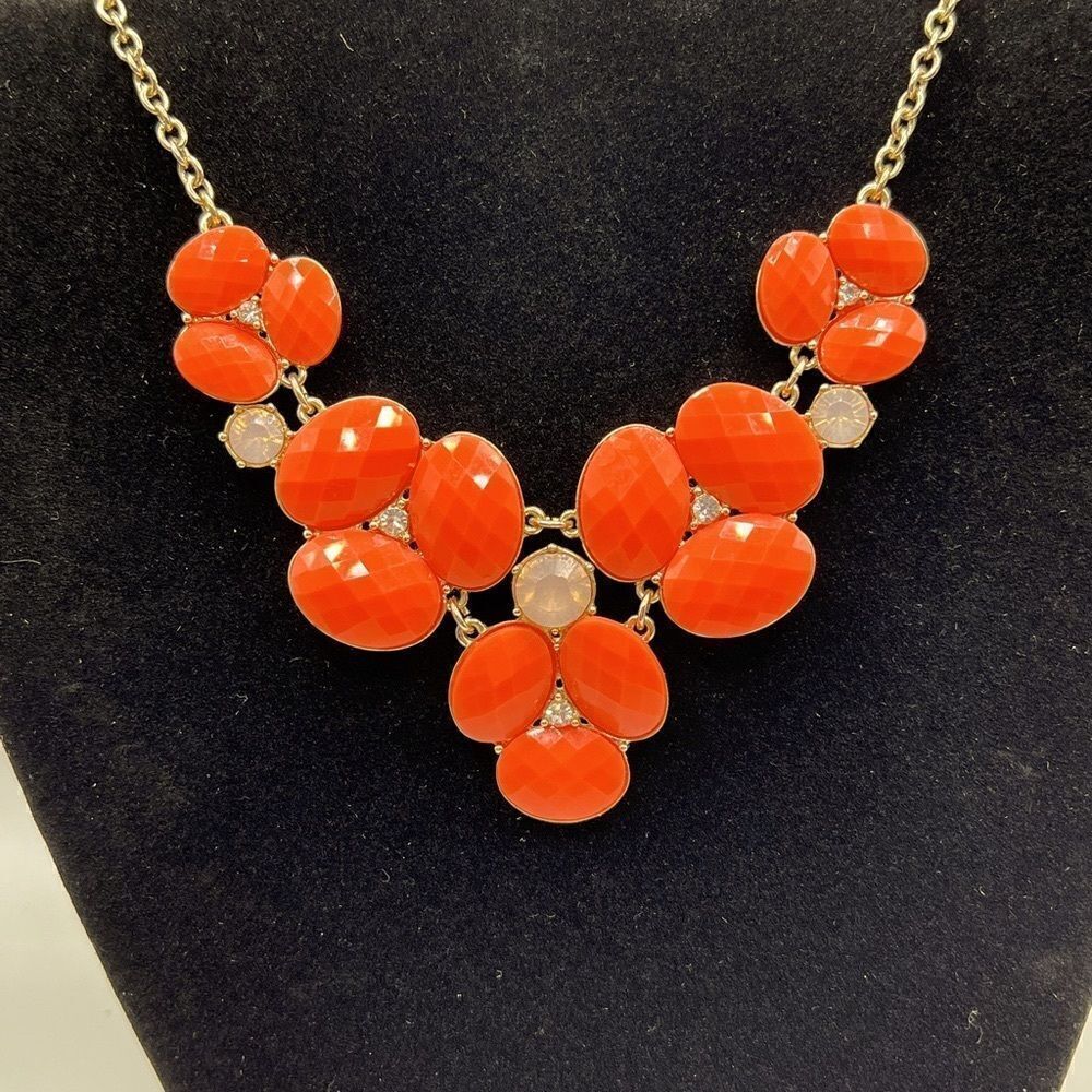 Bauble Box gold toned and coral colored statement necklace